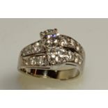 Ring, WG 750, 2 Brillanten zus. ca. 1.20 ct., 12 Brillanten zus. ca. 0.80 ct., alle etwa fw-w/lpr.-