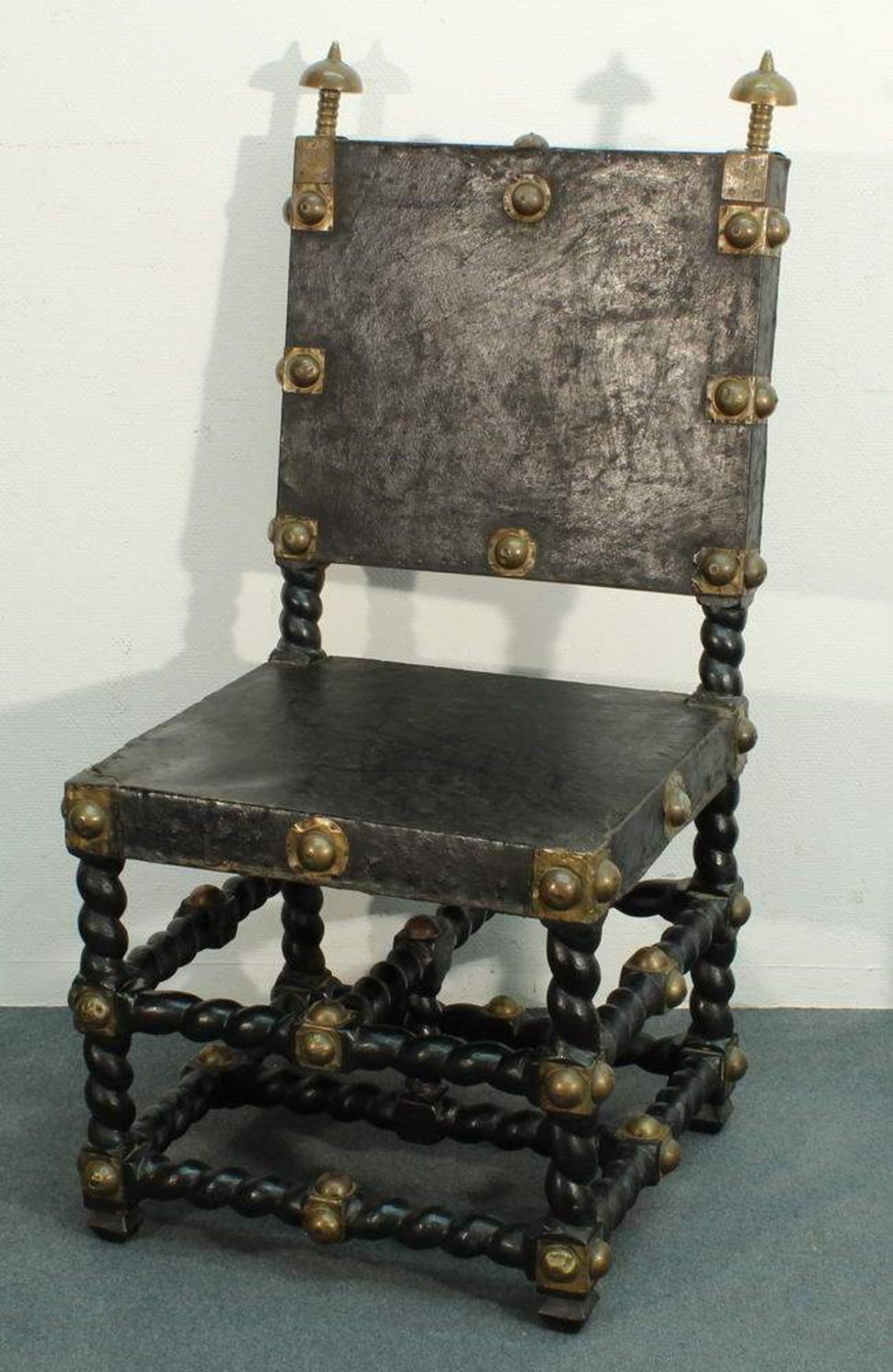 Stuhl, Afrika, Holzgestell und Ledersitz geschwärzt, Zierbeschläge aus Messingblech, 108 cm hoch