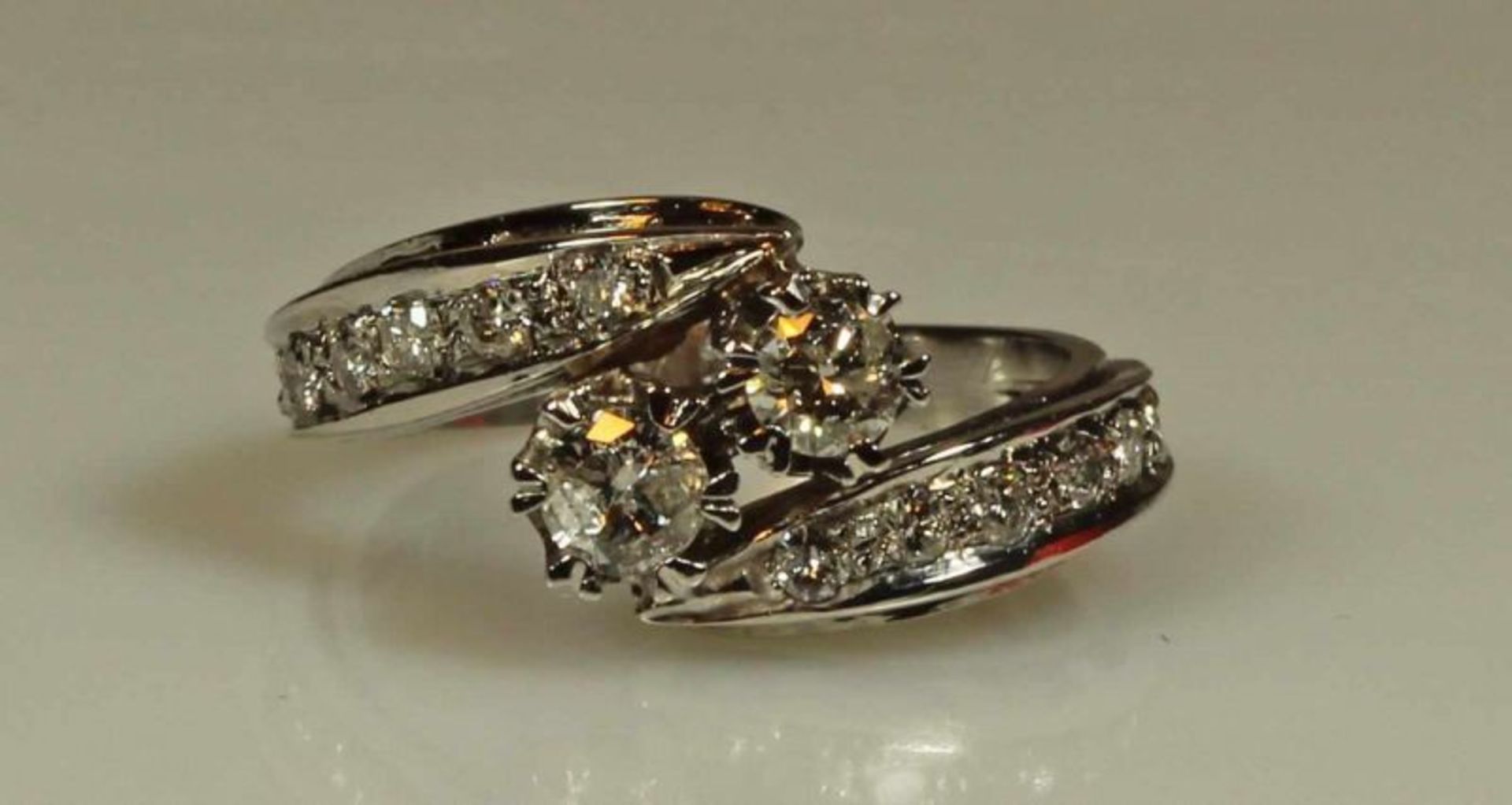 Ring, WG 585, 2 Brillanten zus. ca. 0.40 ct., 14 Besatzdiamanten, 3 g, RM 16.5 20.00 % buyer's