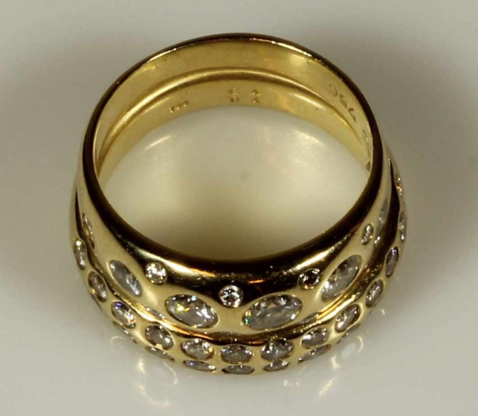 Doppelring, GG 750, 15 Brillanten zus. ca. 1.22 ct., 26 Brillanten (1x Achtkant-Diamant) zus. ca.