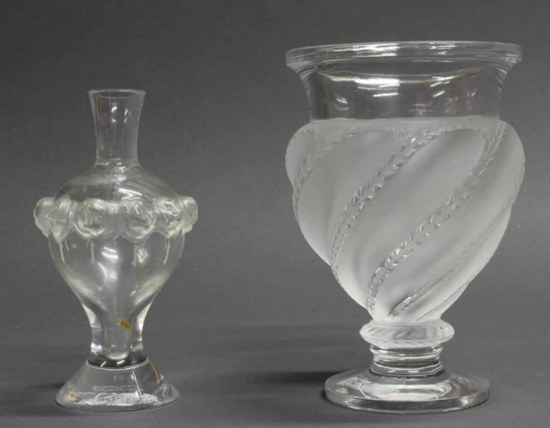 2 Vasen, Lalique, farbloses Glas, teils mattiert, verschiedene Formen, je bezeichnet Lalique France,