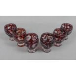 6 GLÄSER, Glas, Böhmen, Mitte 20. Jh.; kannelierter konischer Rundstand, tulpenförmige Kuppa, rot