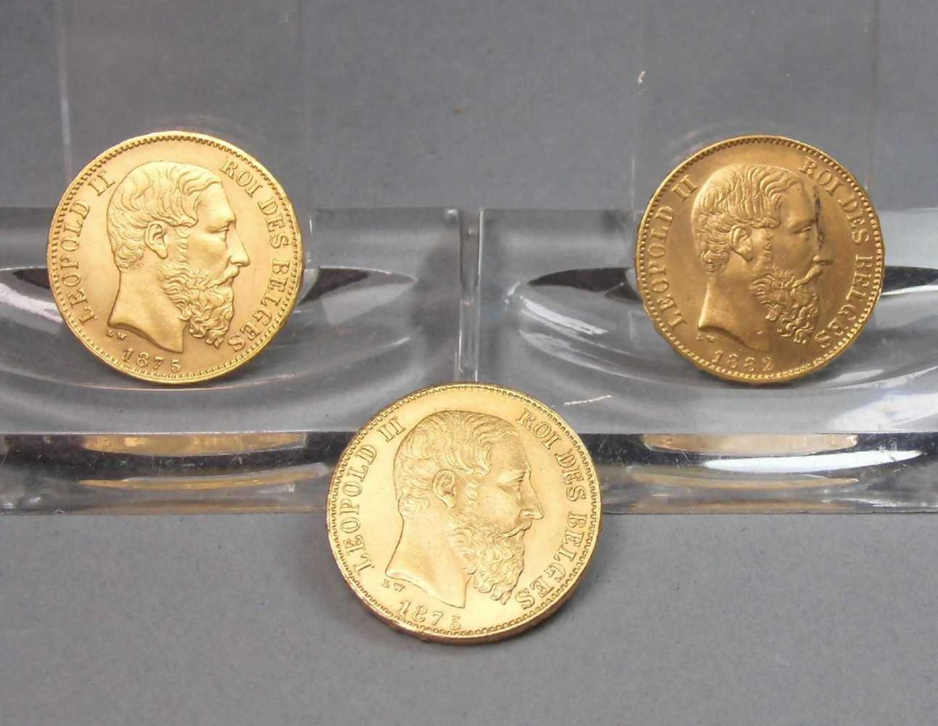 3 GOLDMÜNZEN: "Leopold II von Belgien, 20 Francs", 900er Gold; zweimal von 1875 und einmal von 1882;
