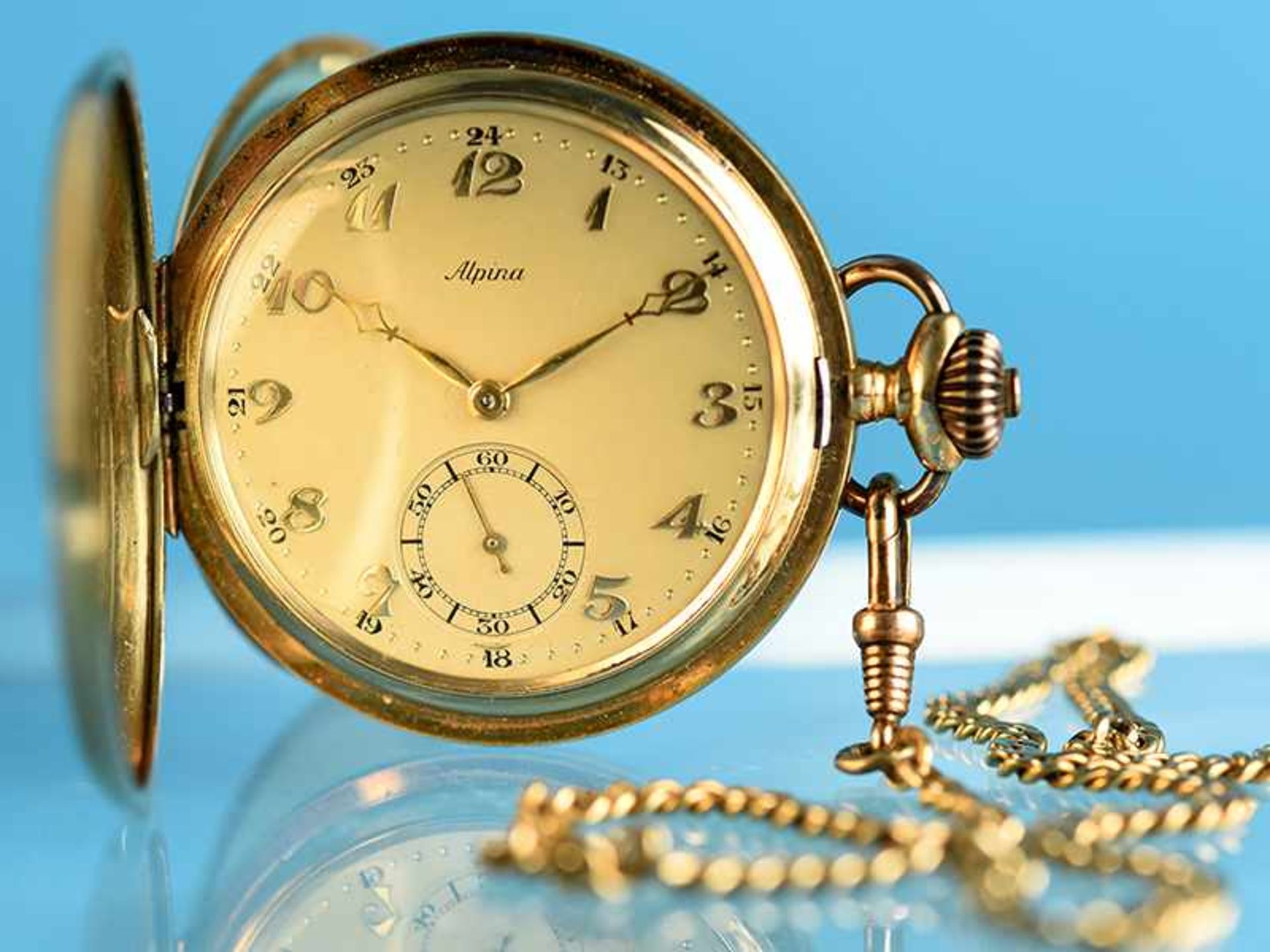 Savonnette-Taschenuhr, bezeichnet Alpina & Uhrenkette, 20. Jh. 1.) Taschenuhr: 585/- Gelbgold.