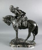 Kosake auf Pferd (wohl Russland, 19.Jh.)Bronze, dunkel patiniert; auf dem Rücken das Gewehr, den
