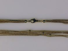 Halskette18ct GG; 6-gliedrig mit Kugeldekor; L: ca. 80 cm; 29g
