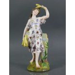 Porzellanfigur (Sitzendorf, um 1900) "Stehende Frau" mit Ähren in den Händen haltend; aus einer