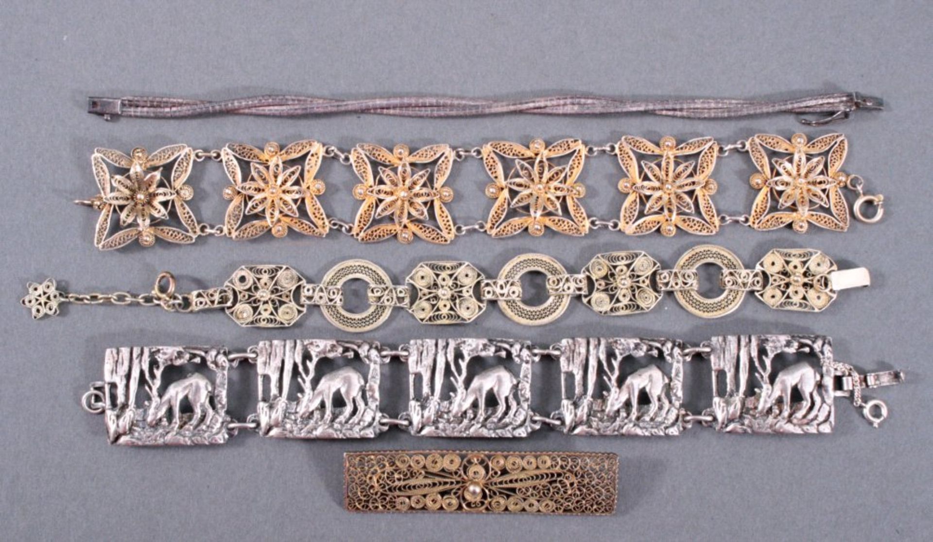Konvolut Silberschmuck5-teilig, bestehend aus 4 Armbänder und einer Brosche, 2Armbänder und