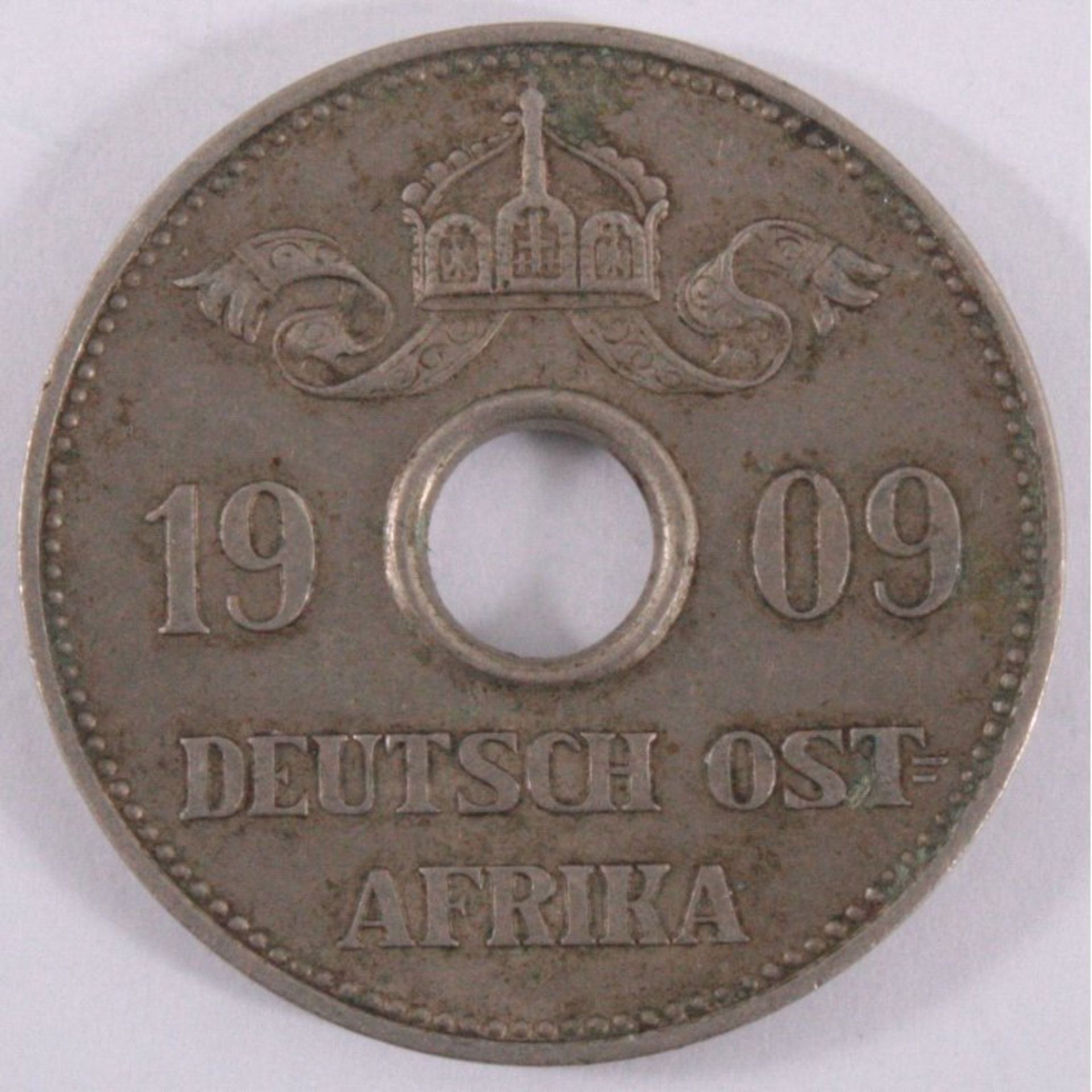 10 Heller 1909 J Deutsch-OstafrikaKupfer-Nickel, 6,25 g, Jäger 719, SS. Mit Münzpaß MDM