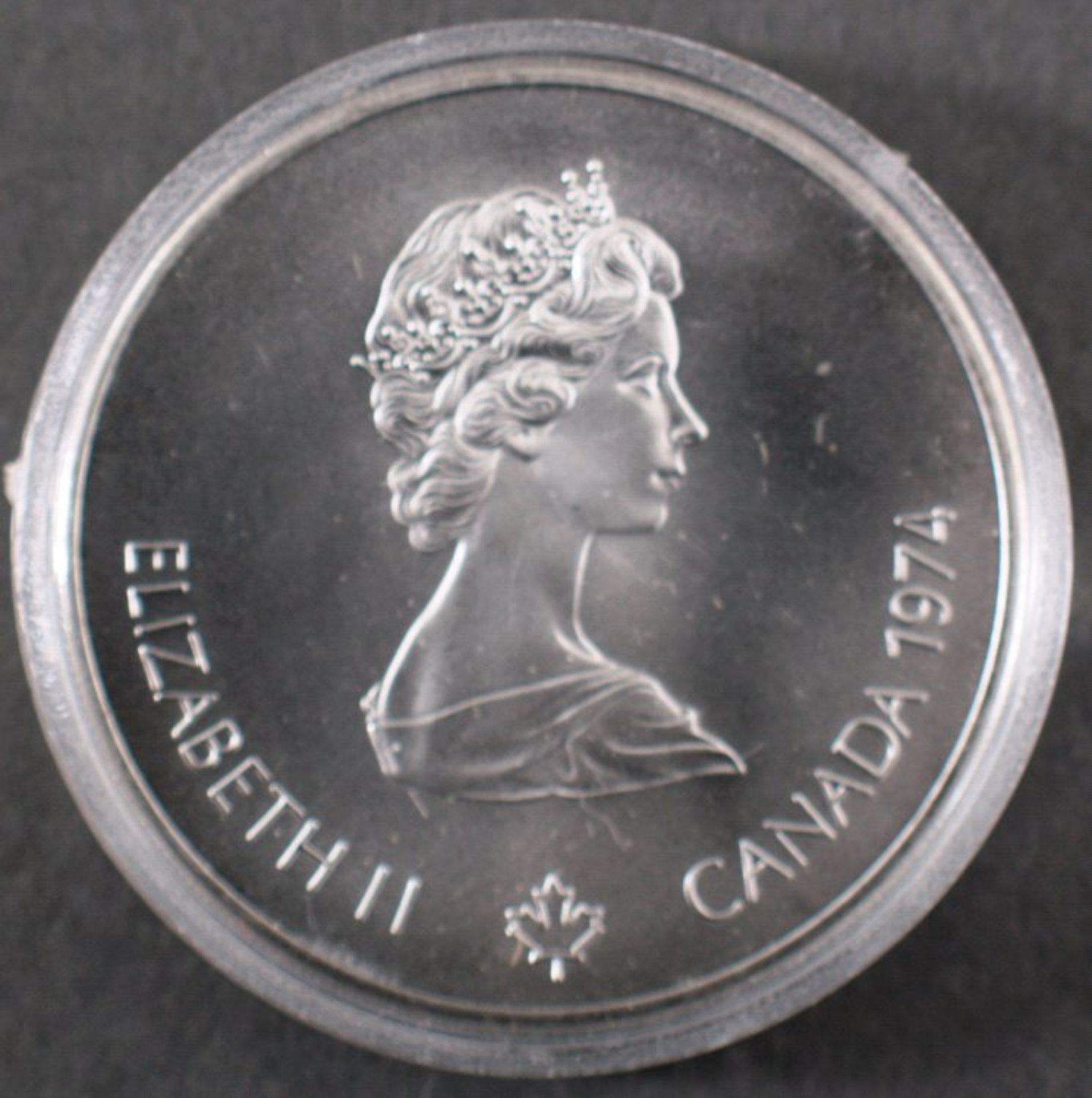 Silbermünze 5 Dollars Canada, Montreal 1976 PPDurchmesser: ca. 3,8 cm. Gewicht (mit Kapsel) 28,7g