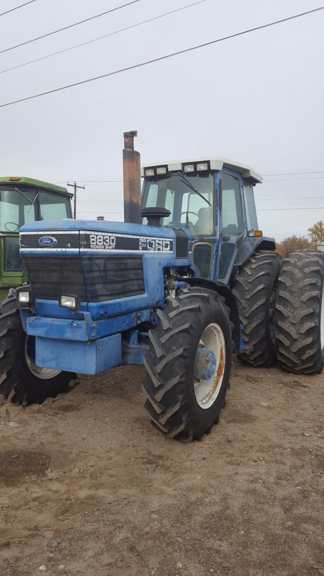 Ford 8830 MFWD power shift trans, 3 hyd. Remotes, 18.4x38 ps dual Rubber weights Runs good 8700hr
