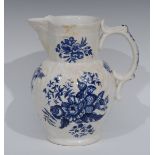 A Worcester cabbage leaf moulded mask jug, printed in underglaze blue with peonies and pine cones,