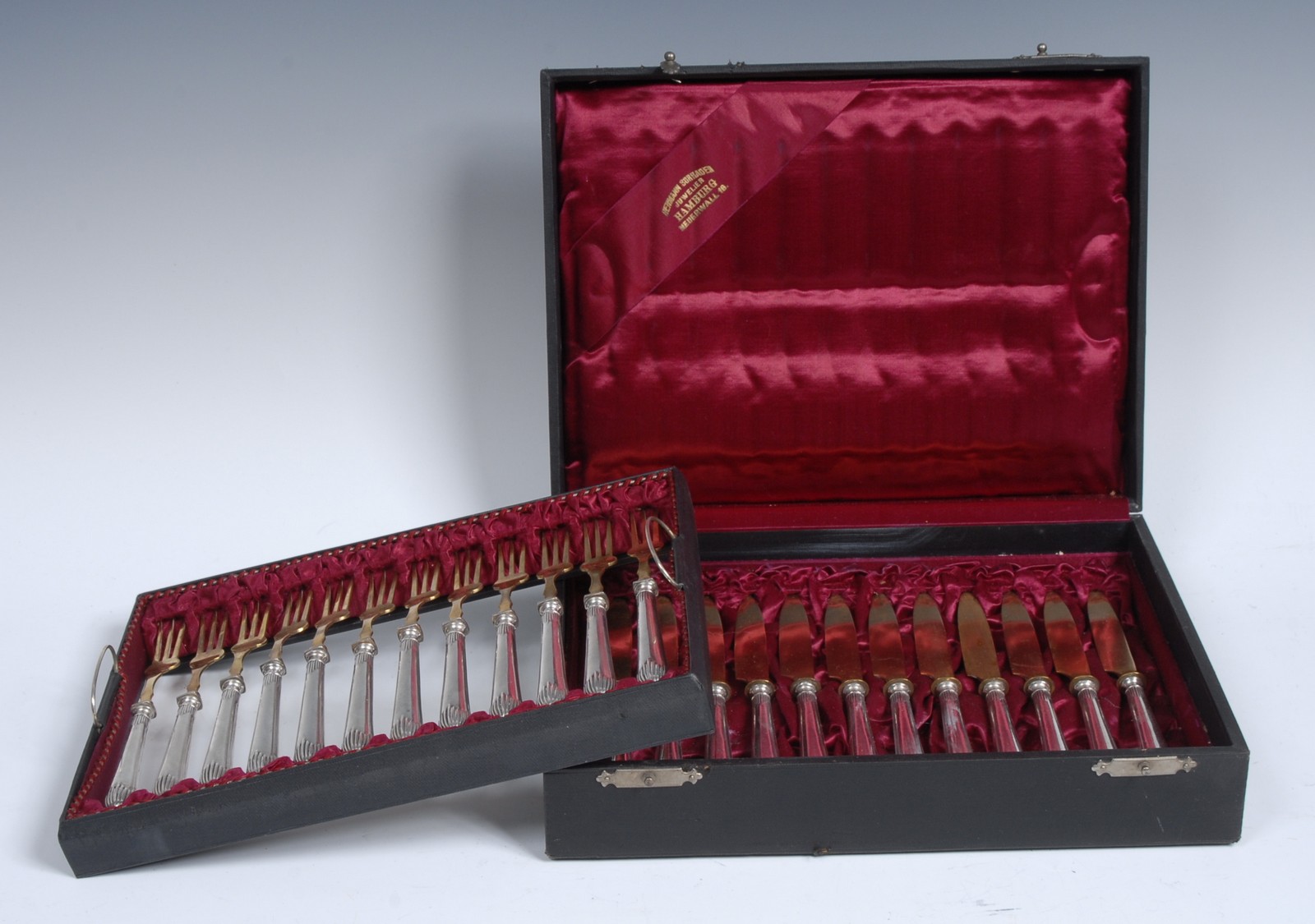 A German parcel-gilt silver fruit service, comprising twelve pairs of knives and forks,