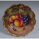 A Royal Worcester shaped circular plate, painted by  Harry Ayrton, signed, with peaches,