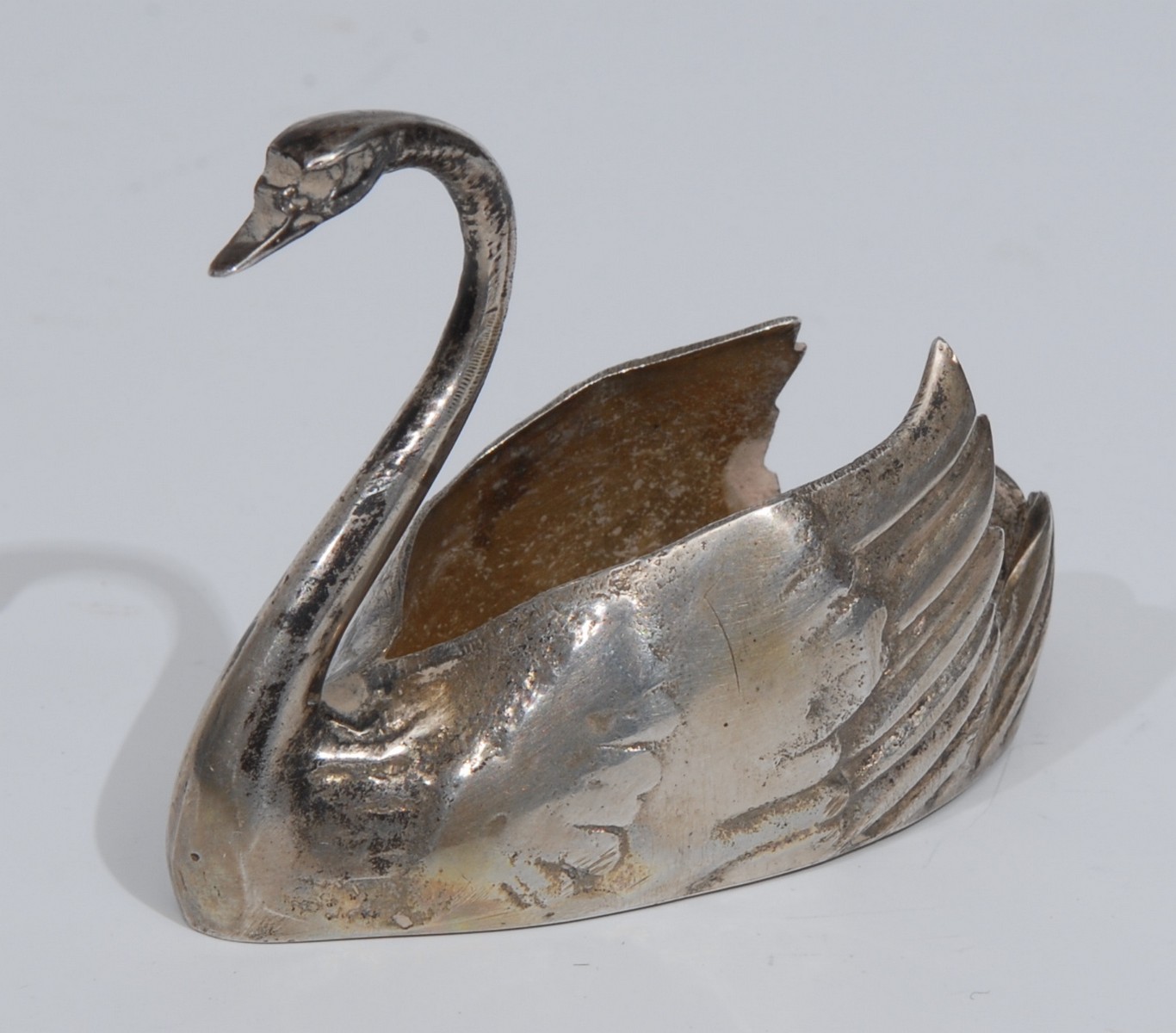 A Chinese silver novelty salt, as a swan, gilt interior,