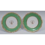 A pair of Flight Barr & Barr Worcester shaped circular plates, the fields painted with crest,