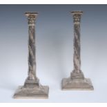 A pair of George III old Sheffield plate Corinthian column table candlesticks,