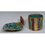 A majolica strawberry dish, with birds nest and bird, the dish in relief with leaves and flowers,