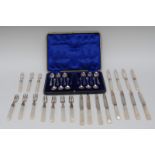 A set of twelve silver tea spoons, bows ensuite, cased,