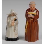 A Royal Worcester candlesnuffer, Nun, in habit and wimple clutching a prayer book, 9.