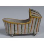 A Prattware creamware cradle, in relief with  basketwork coloured in tones of green,