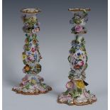 A pair of Coalbrookedale candlesticks, encrusted overall with flowers and foliage,