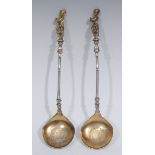 A pair of early Victorian parcel-gilt silver serving spoons, in the Renaissance taste,