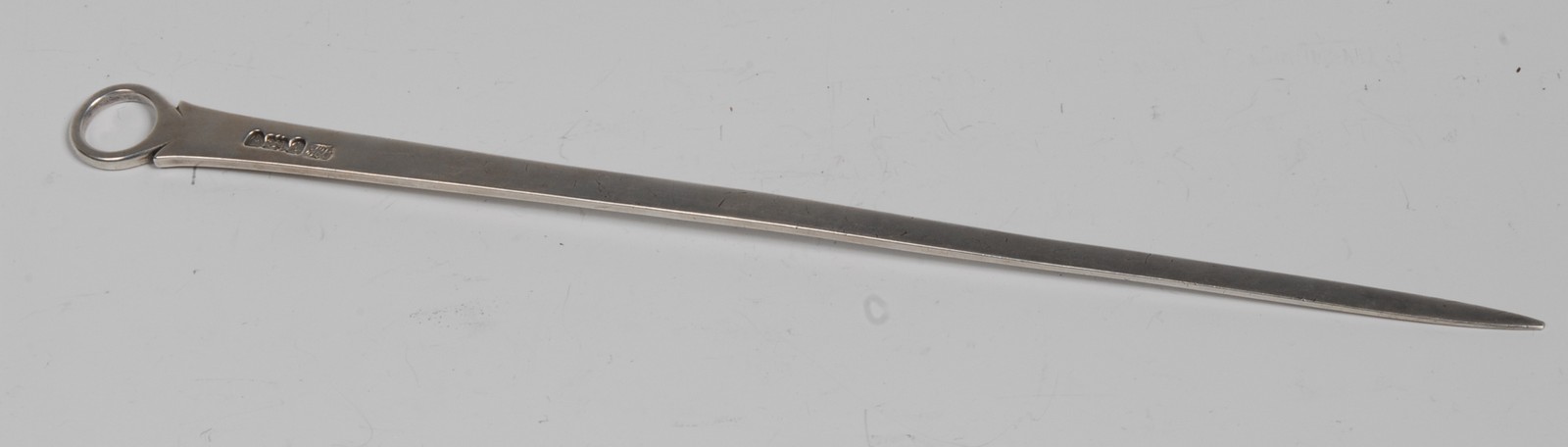 A George III silver meat skewer, ring terminal, crested, 35.