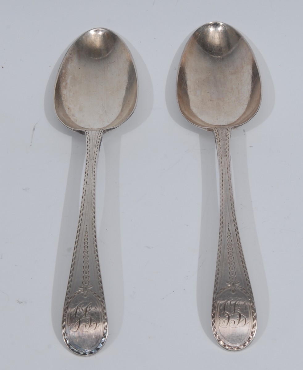 Hester Bateman - a pair of George III silver Bright-cut Old English pattern dessert spoons,