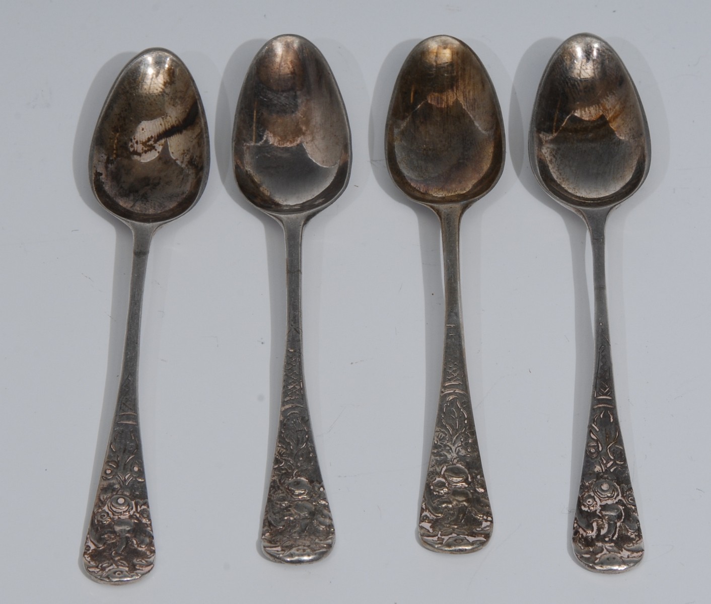 A set of four 18th century silver Hanoverian pattern picture back teaspoons,