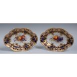 A pair of Royal Worcester shaped oval plates, painted by Richard Seabright and Martin, signed,