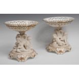 A pair of Victorian Parian and porcelain comports, the pierced bowls,