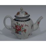 A Liverpool ribbed ovoid teapot and cover, decorated with with peony and other flowers and foliage,