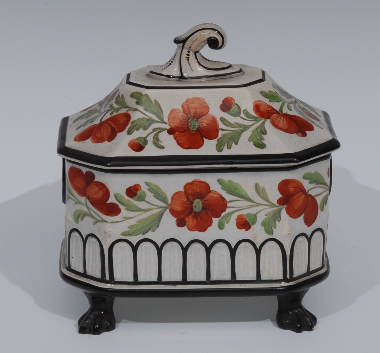 A Prattware creamware canted rectangular casket, paitned iwht poppies, in red and green,