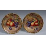 A pair of Royal Worcester shaped circular plates, painted by Price, signed, with apples, pears,