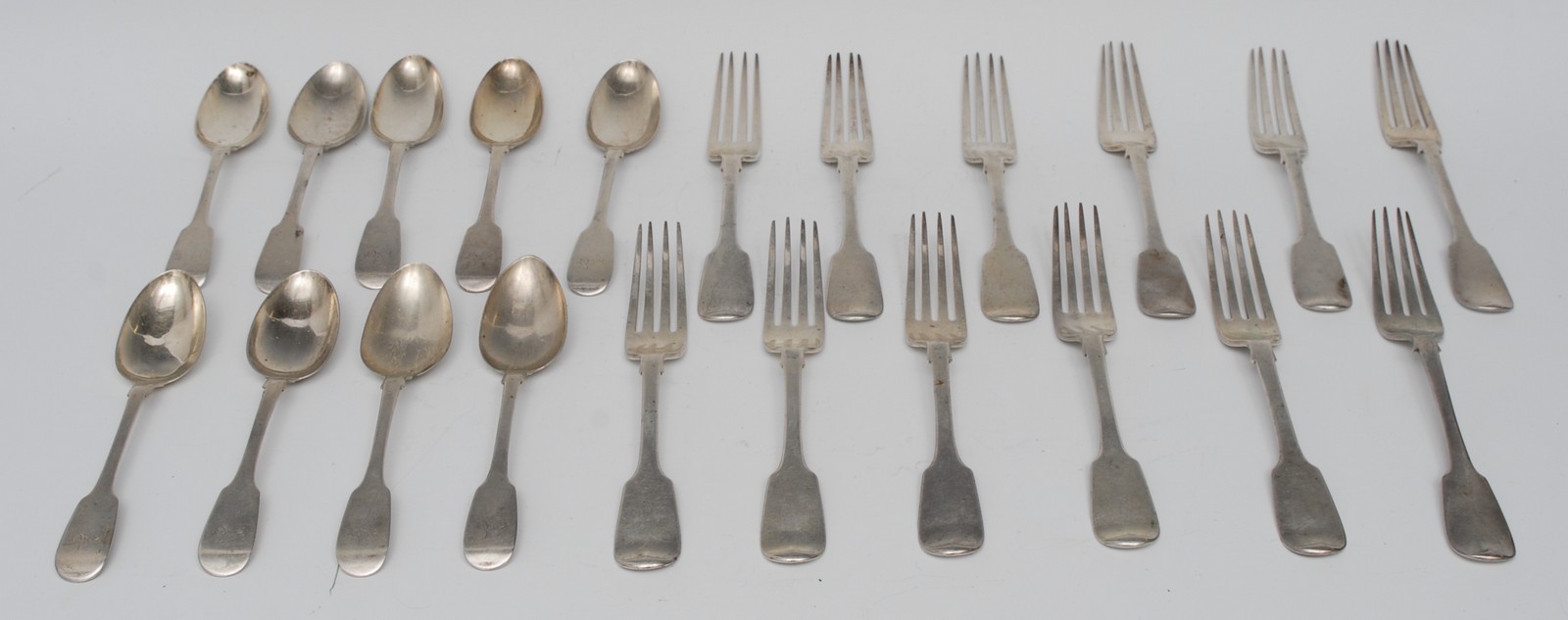 A matched set of twelve William IV/early Victorian Scottish silver Fiddle pattern table forks,