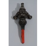 A 19th century silver baby's rattle, embossed and engraved with flowerheads and scrolling leaves,