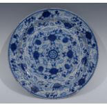A Maiolica circular blue and white charger,