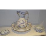 A Staffordshire wash jug and bowl printed with blue and white cornflowers; a conforming soap dish;