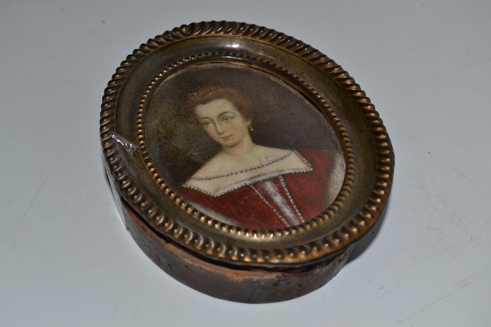 English School, a portrait miniature, of a lady in 16th century dress, oval, watercolour on ivory,