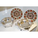 A pair of Royal Crown Derby 1128 pattern plates; an EPNS Art Deco warming stand;
