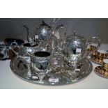 A silver plated Rococo style four piece tea service, chased and engraved overall, scroll handles,