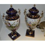 A pair of table urns &  covers, each decorated with butterflies and flowers, gilt highlights,