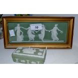 A Wedgwood green jasperware plaque in relief in white, with Neo Classical ladies,