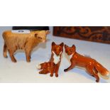 A Beswick model of a seated fox, black printed marks; another, on all fours,