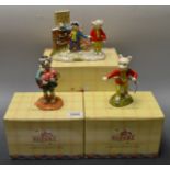 A Royal Doulton Rupert The Bear figure, boxed; two others,