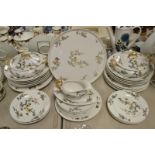 A Limoges chinoiserie dinner service comprising, tureens, meat plate, sauce boat,