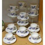 A set of twelve Richard Ginori coffee cups and saucers, printed with blue flowers on a white ground,