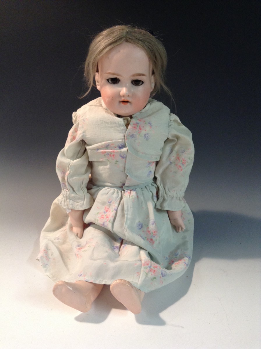 An Armand Marseille bisque head and shoulder doll, impressed 370, A.