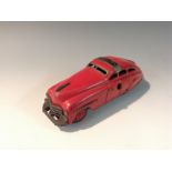 A Schuco Fex 1111 tinplate clockwork car, maroon red,